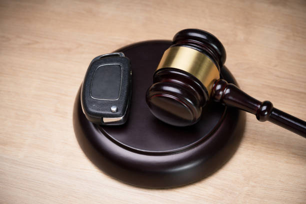 Nadi Law – Criminal Lawyer & Employment Lawyer – Oshawa, Whitby, Pickering, Ajax & Toronto | DUI Charges Ontario: What Happens After an Impaired Driving Charge? Car Key And Mallet On The Striking Block Over Table Overhead View Of A Car Key And Mallet On The Striking Block DUI Charges stock pictures, royalty-free photos & images