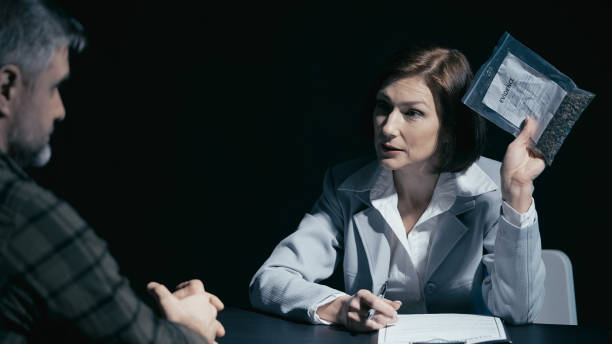 Nadi Law – Criminal Lawyer & Employment Lawyer – Oshawa, Whitby, Pickering, Ajax & Toronto | Domestic Assault Defence Ontario: What You Should Know After a Charge Drug control detective presents an evidence bag to a male suspect during a crime investigation Drug control detective presents an evidence bag to a male suspect during a crime investigation domestic assault lawyers stock pictures, royalty-free photos & images