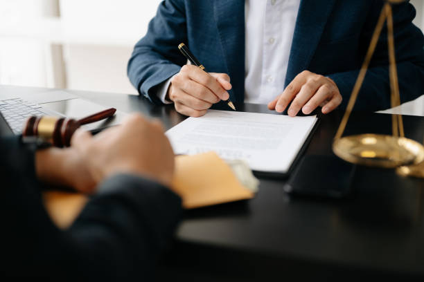 Nadi Law – Criminal Lawyer & Employment Lawyer – Oshawa, Whitby, Pickering, Ajax & Toronto | Domestic Assault Defence Ontario: What You Should Know After a Charge Two lawyers are discussing about contract paper, law matters determination, pointing.law and hammer on the table Two lawyers are discussing about contract paper, law matters determination, pointing.law and hammer on the table in office lawyers stock pictures, royalty-free photos & images